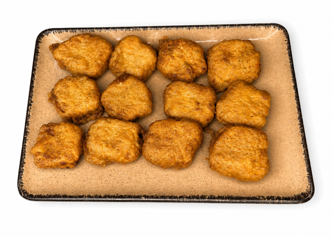 A rectangular beige ceramic plate with a dark rim, holding nine golden-brown fried food pieces arranged in three rows, isolated on a white background.